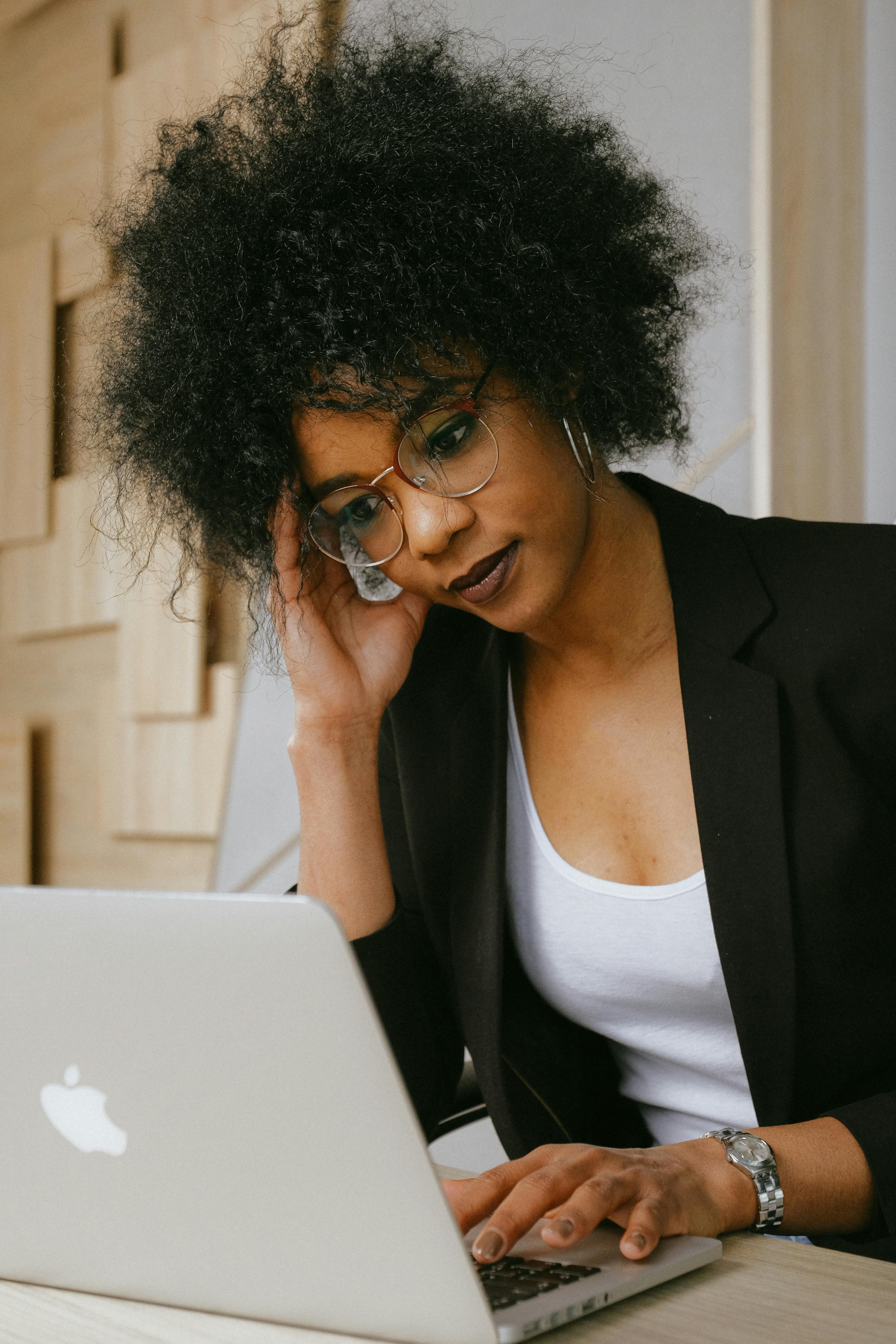 Woman In Black Blazer Wearing Eyeglasses